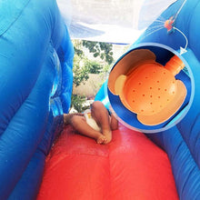 Load image into Gallery viewer, a person in a blue jacket and a red fire hydrant
